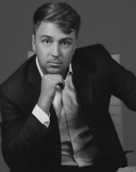 Nick Polyushkin, black-and-white portrait.